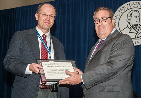Jürgen Unützer, MD, MPH, MA accepts the APA Certificate of Significant Achievement for BHIP